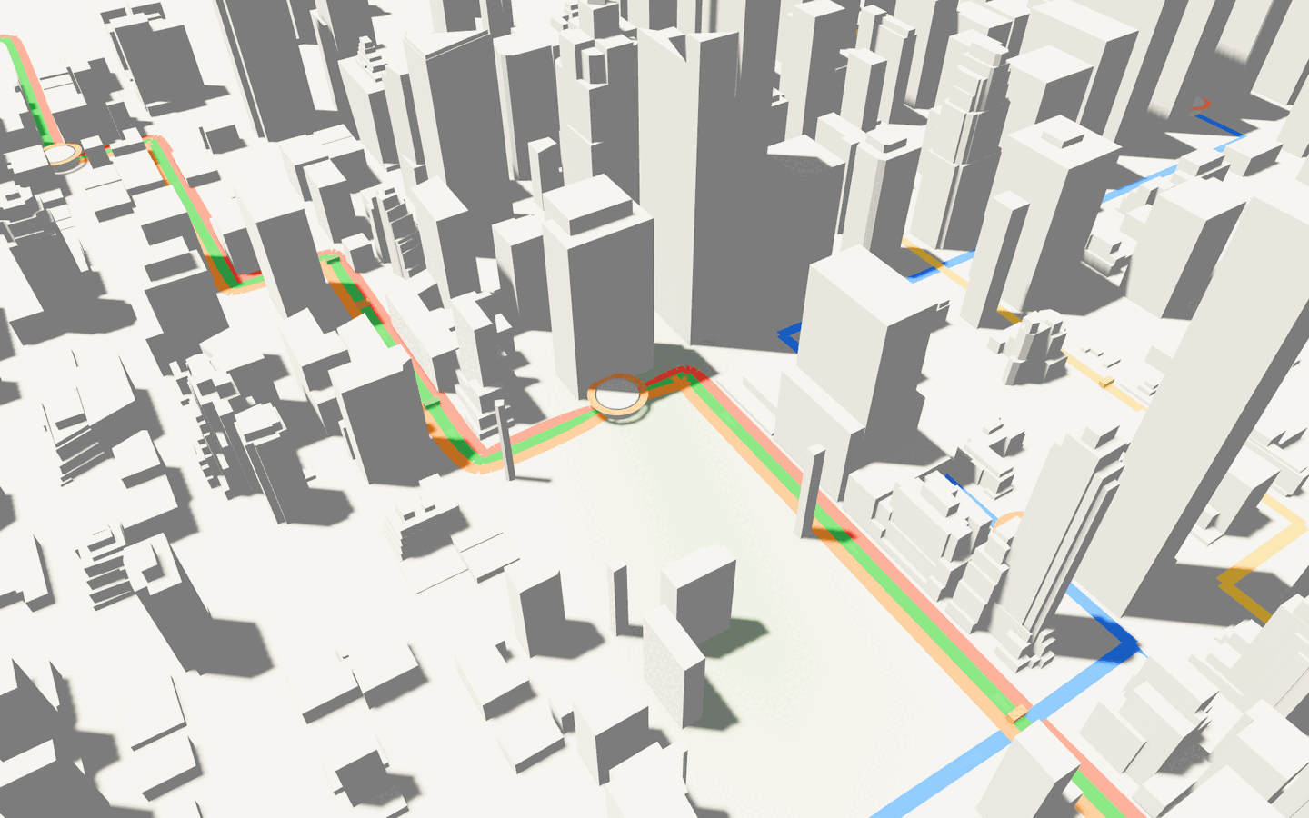 Down in the street canyon, transit routes threading between towers